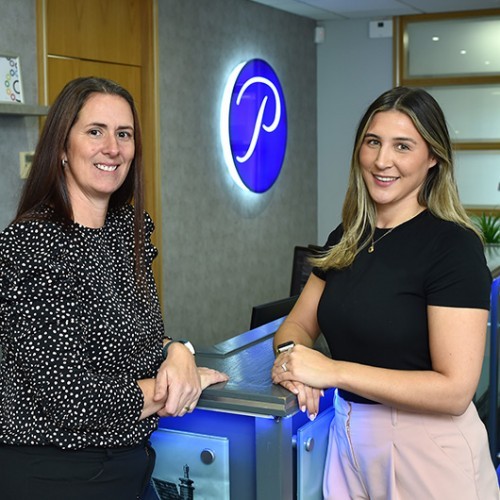 Two accountants standing in the Pierce reception